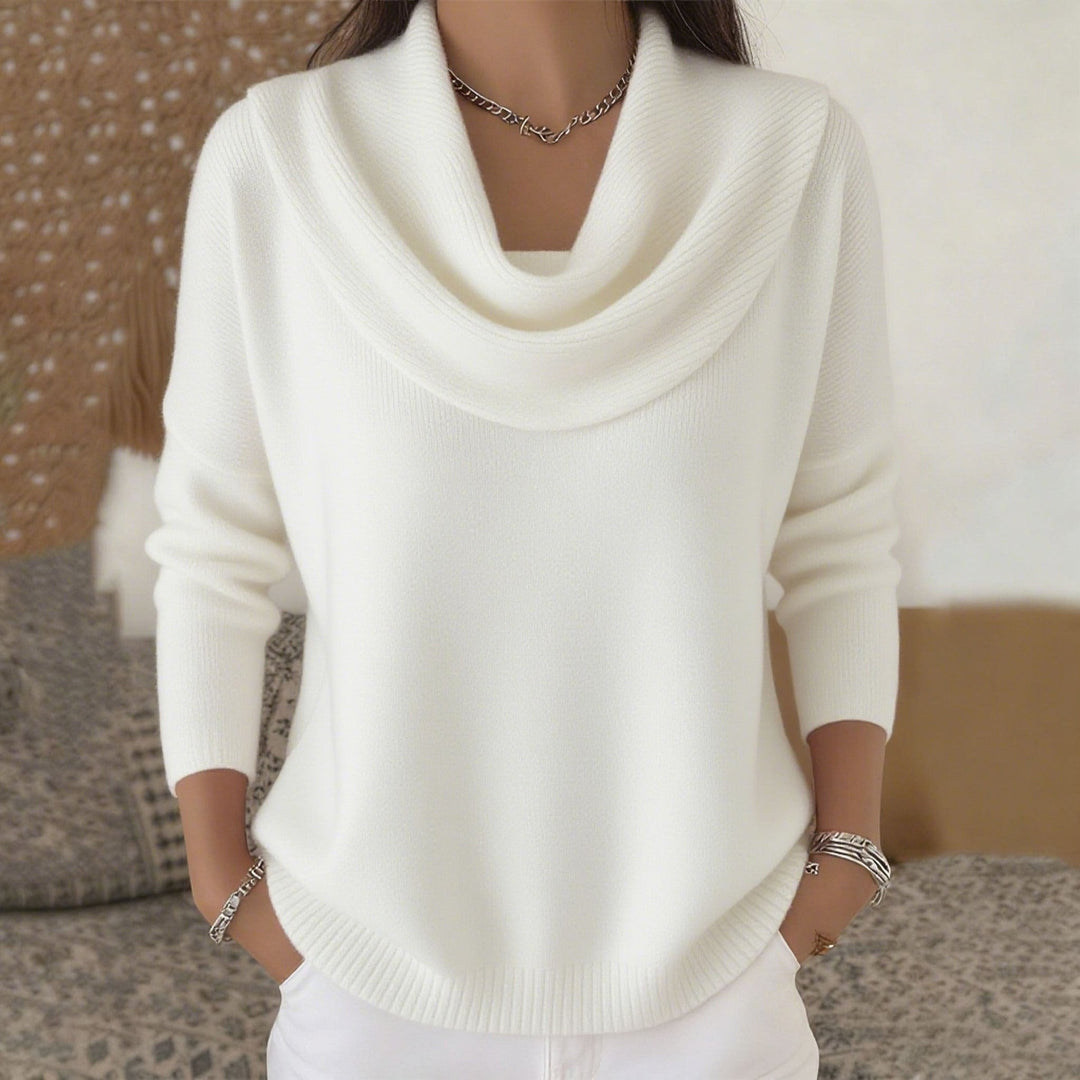 Woman wearing cowl neck knit sweater with long sleeves