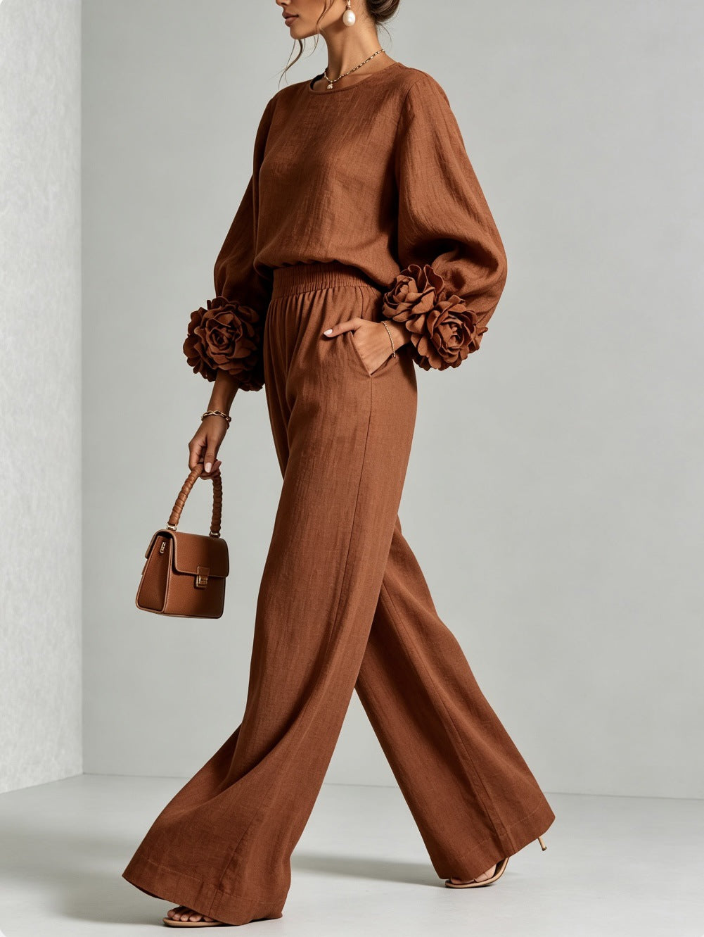Woman wearing floral two-piece set with wide-leg pants