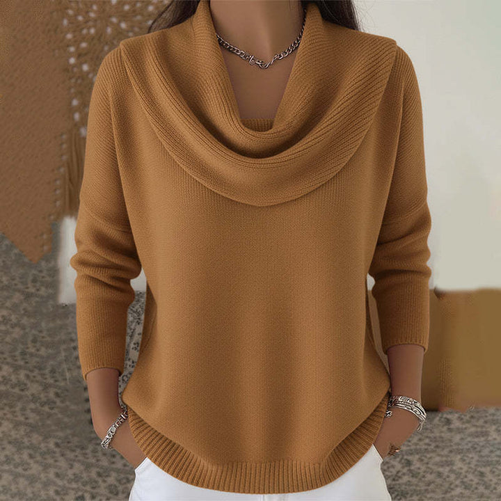 Woman wearing cowl neck knit sweater with long sleeves