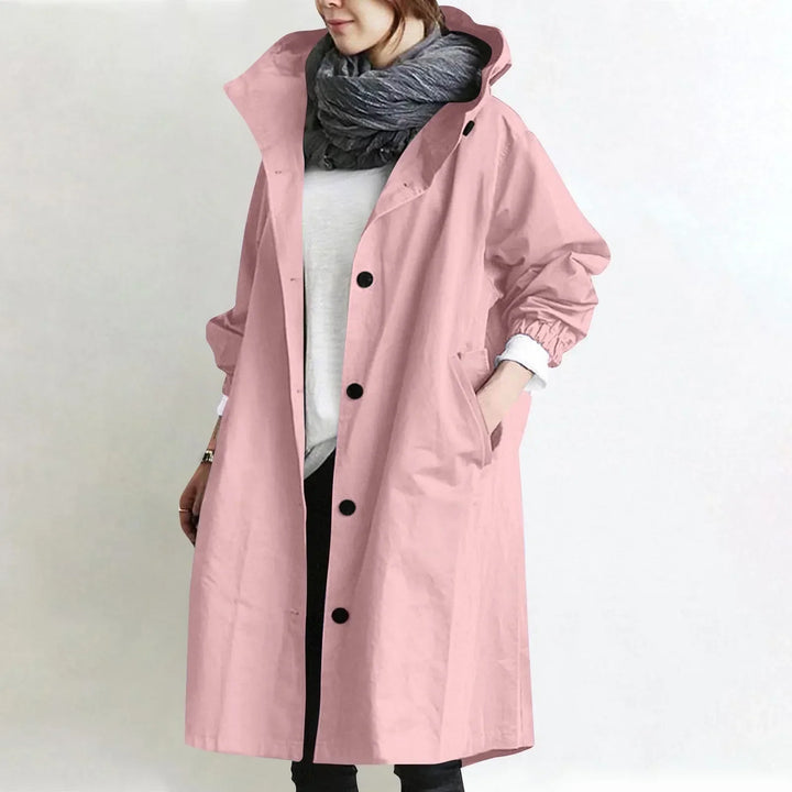 Woman wearing long hooded button-front coat outdoors