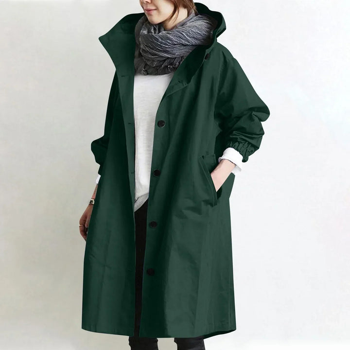 Woman wearing long hooded button-front coat outdoors
