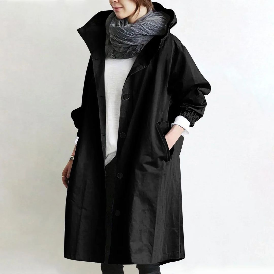 Woman wearing long hooded button-front coat outdoors