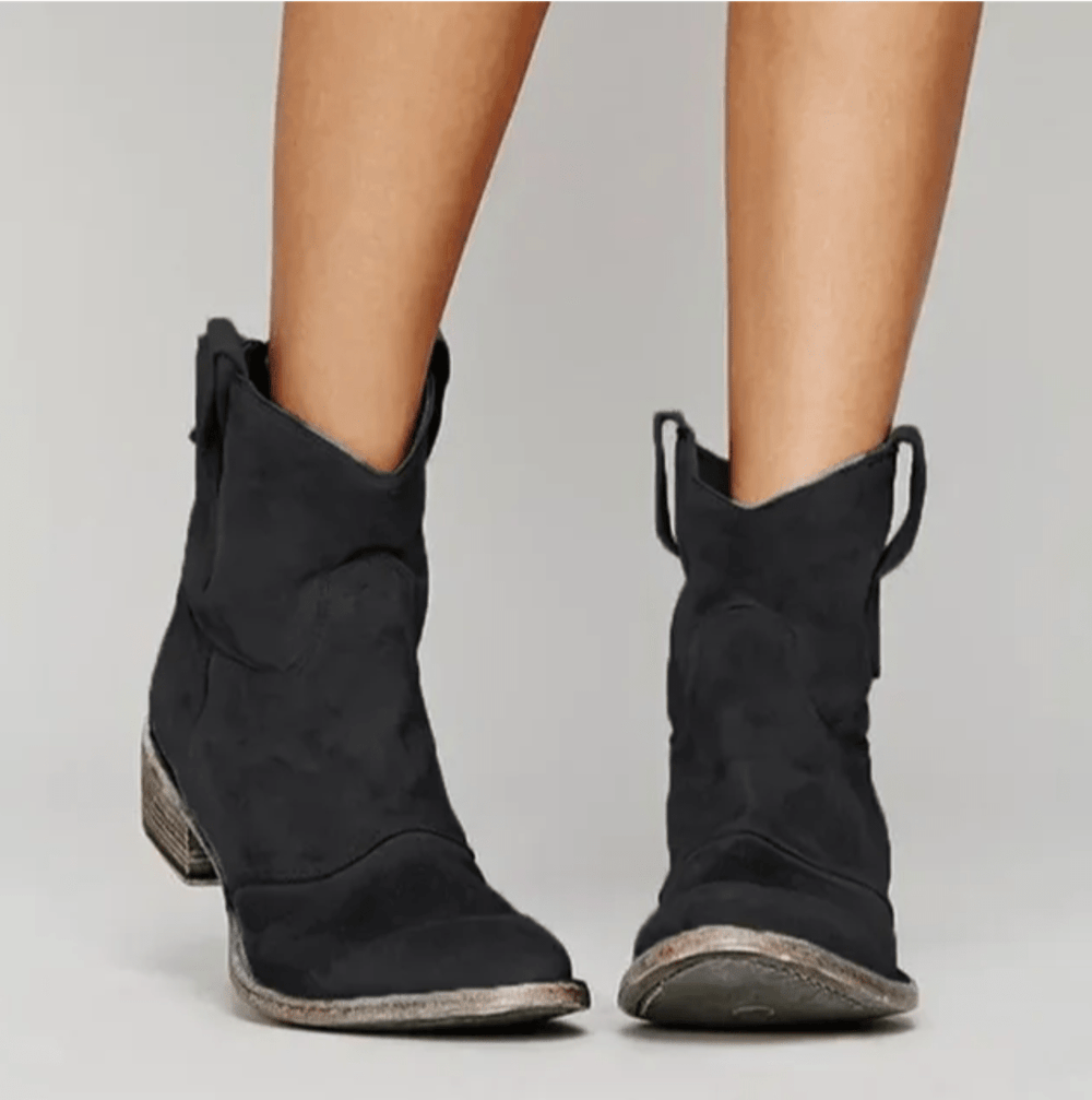 Woman wearing block heel orthopedic boots with side zip