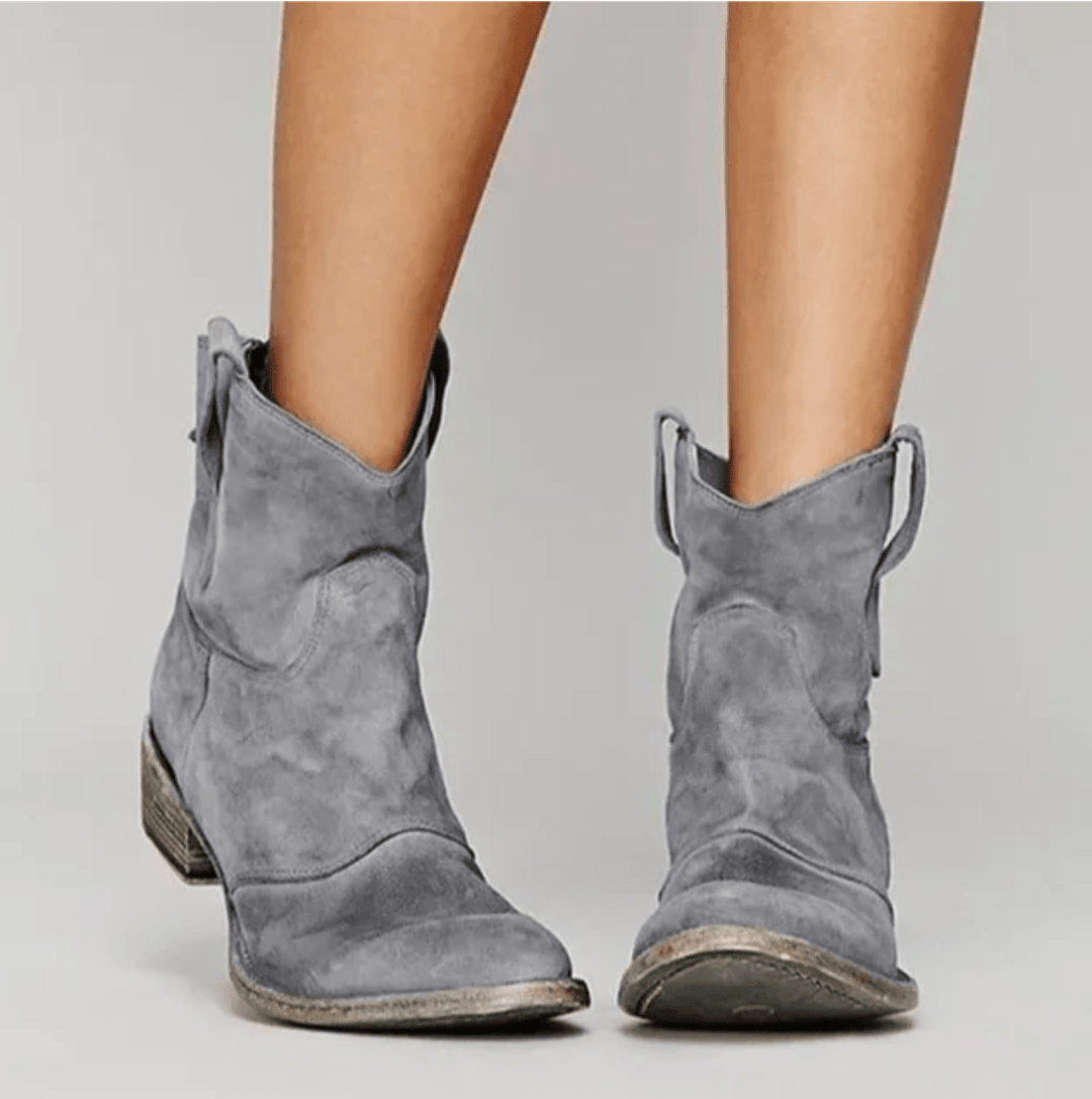 Woman wearing block heel orthopedic boots with side zip