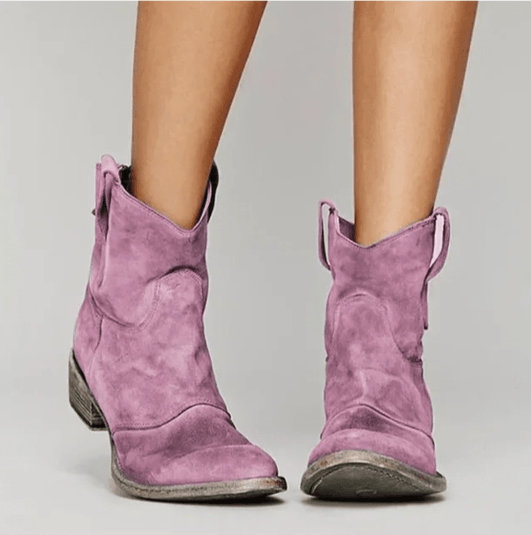 Woman wearing block heel orthopedic boots with side zip