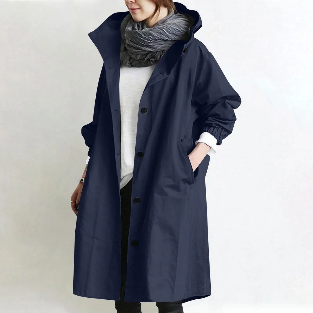 Woman wearing long hooded button-front coat outdoors