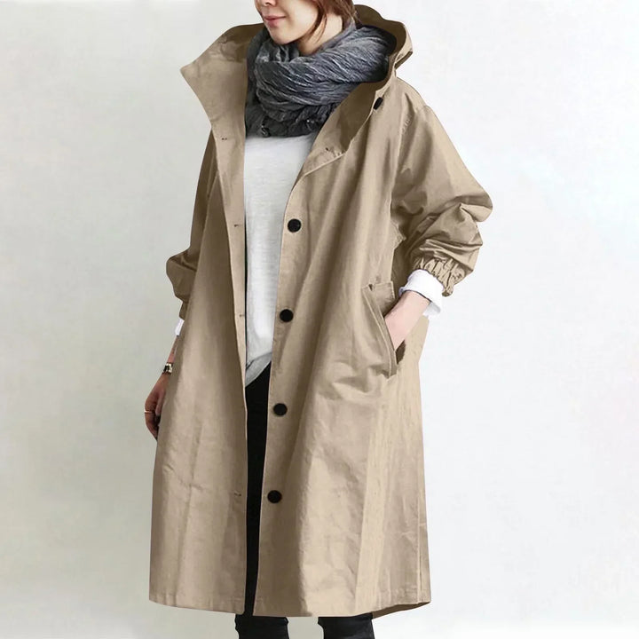 Woman wearing long hooded button-front coat outdoors