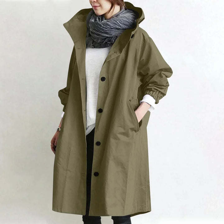Woman wearing long hooded button-front coat outdoors