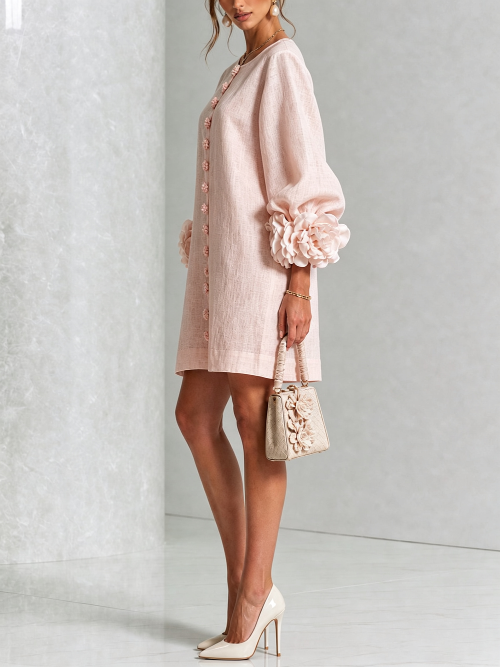 Pink floral mini dress with long sleeves and rosette cuffs