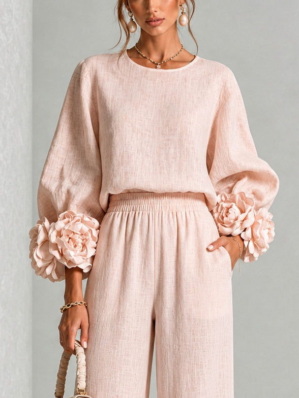 Woman wearing floral two-piece set with wide-leg pants
