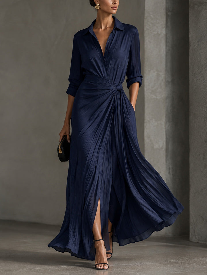 Woman wearing navy V-neck maxi shirt dress with knotted waist