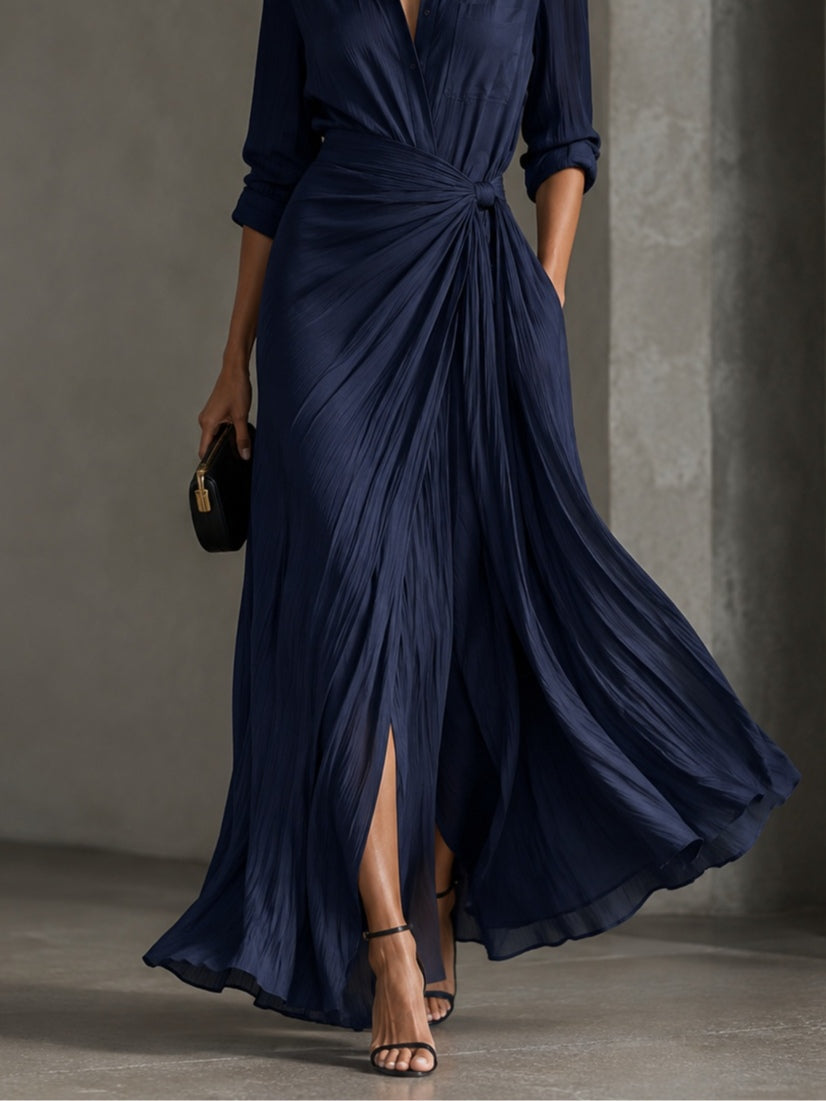 Woman wearing navy V-neck maxi shirt dress with knotted waist