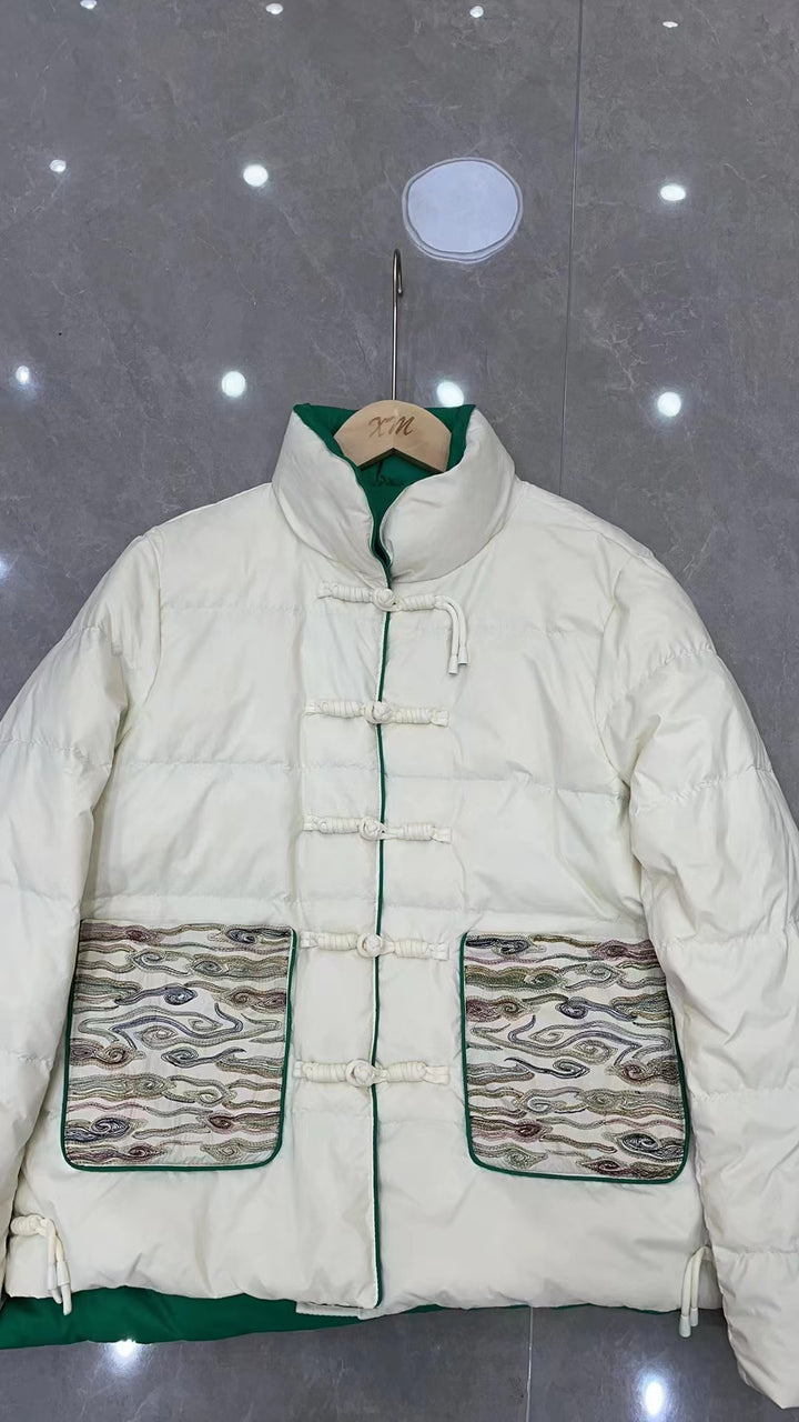 Woman wearing short embroidered down jacket with long sleeves