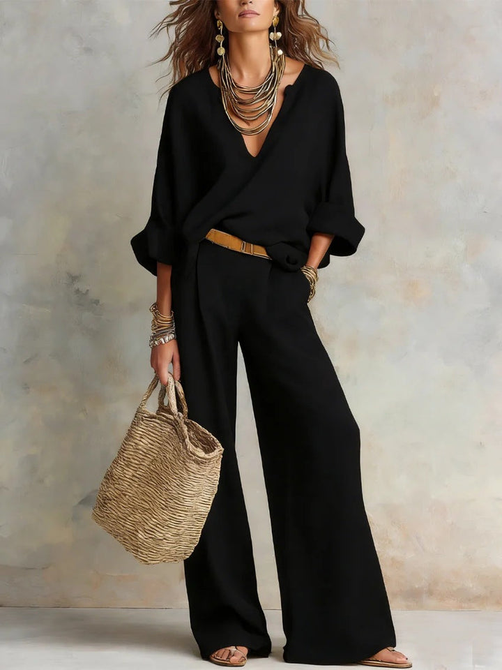 Woman wearing relaxed V-neck two piece set with wide-leg trousers