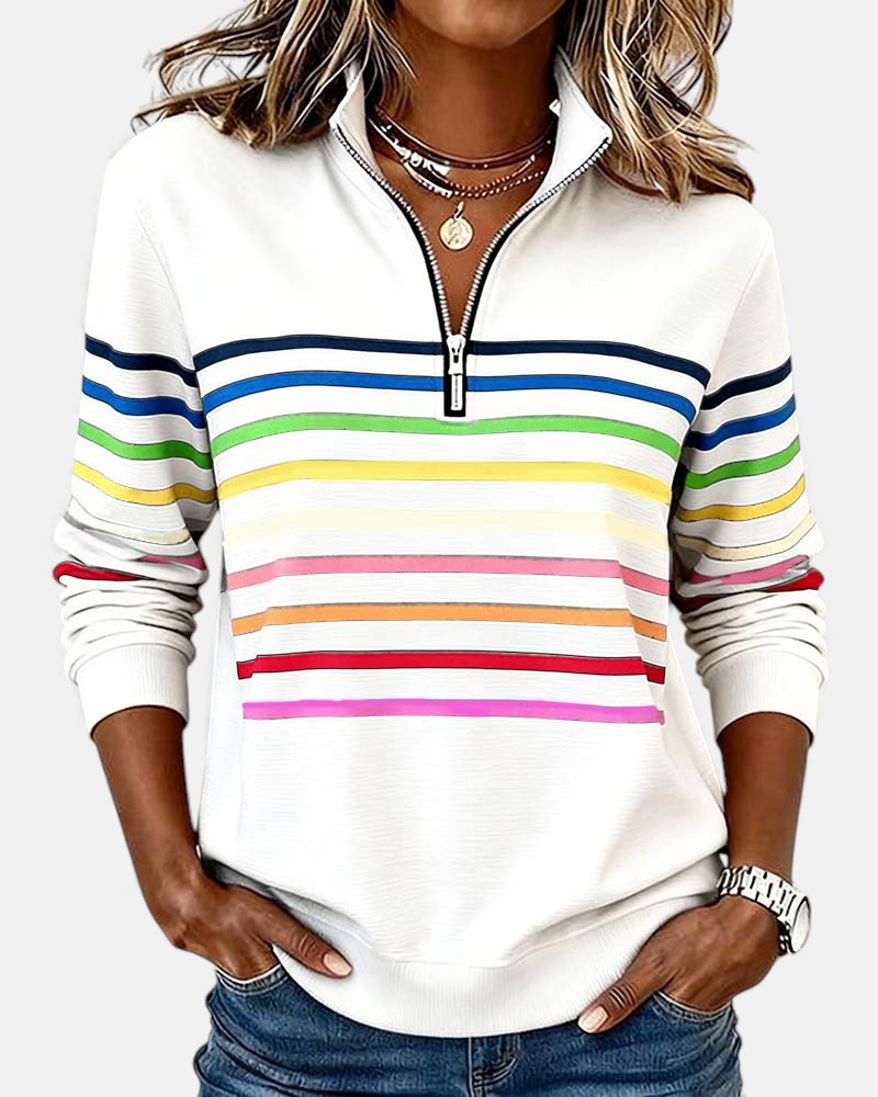 Woman wearing rainbow striped half zip sweatshirt