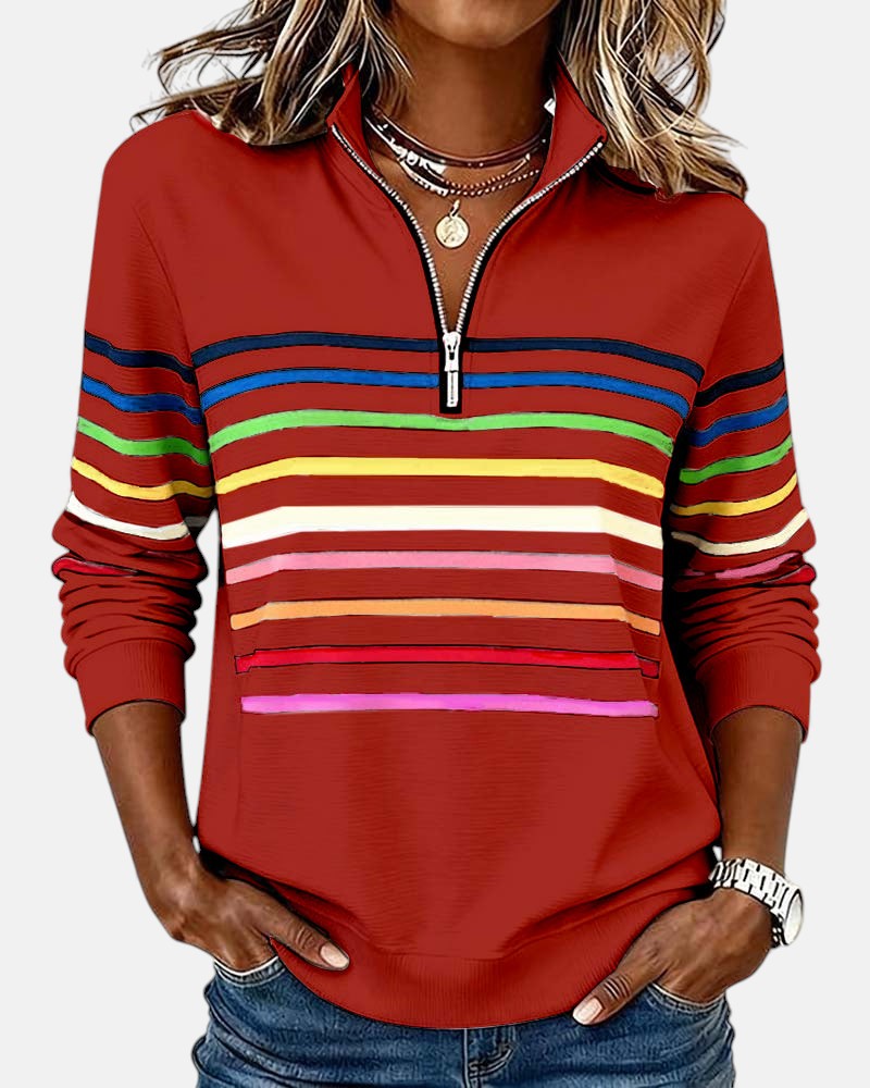 Woman wearing rainbow striped half zip sweatshirt