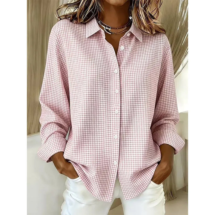 Woman wearing gingham button-front blouse with long sleeves