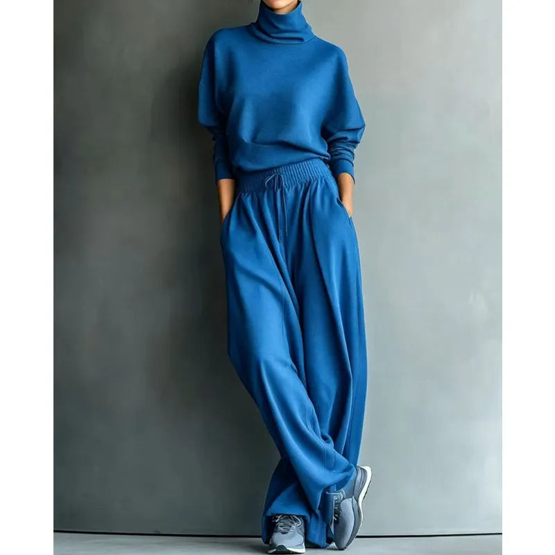 Woman wearing black turtleneck two-piece set with wide-leg trousers