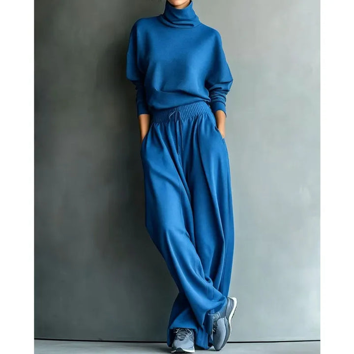 Woman wearing black turtleneck two-piece set with wide-leg trousers
