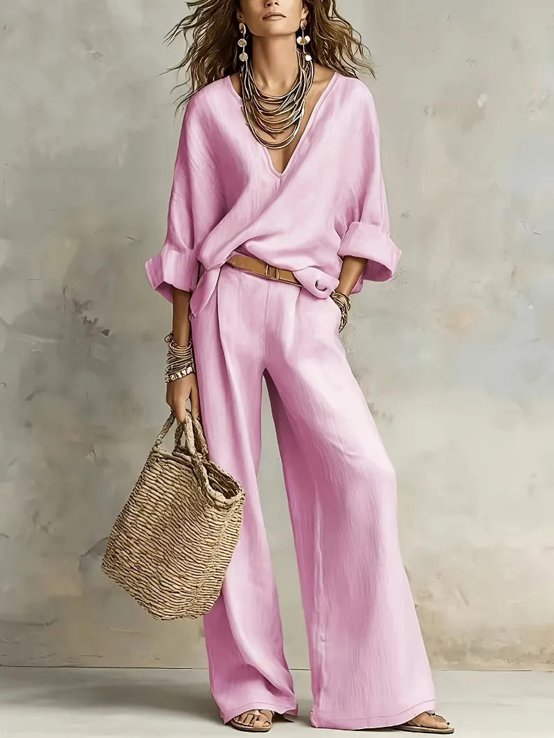 Woman wearing relaxed V-neck two piece set with wide-leg trousers