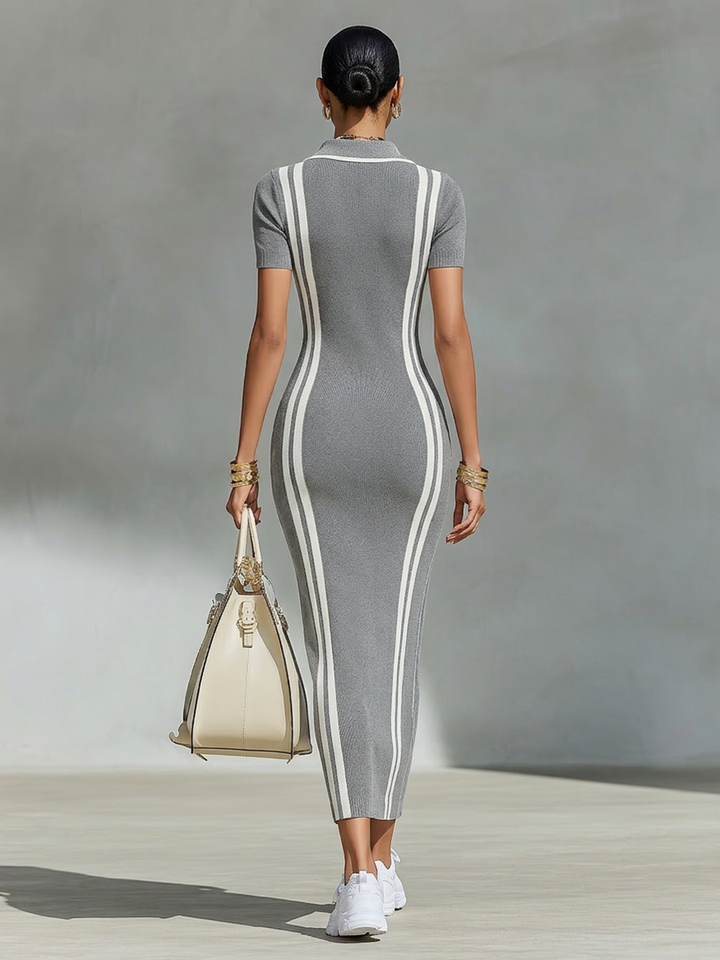 Woman wearing gray knit maxi dress with zip collar