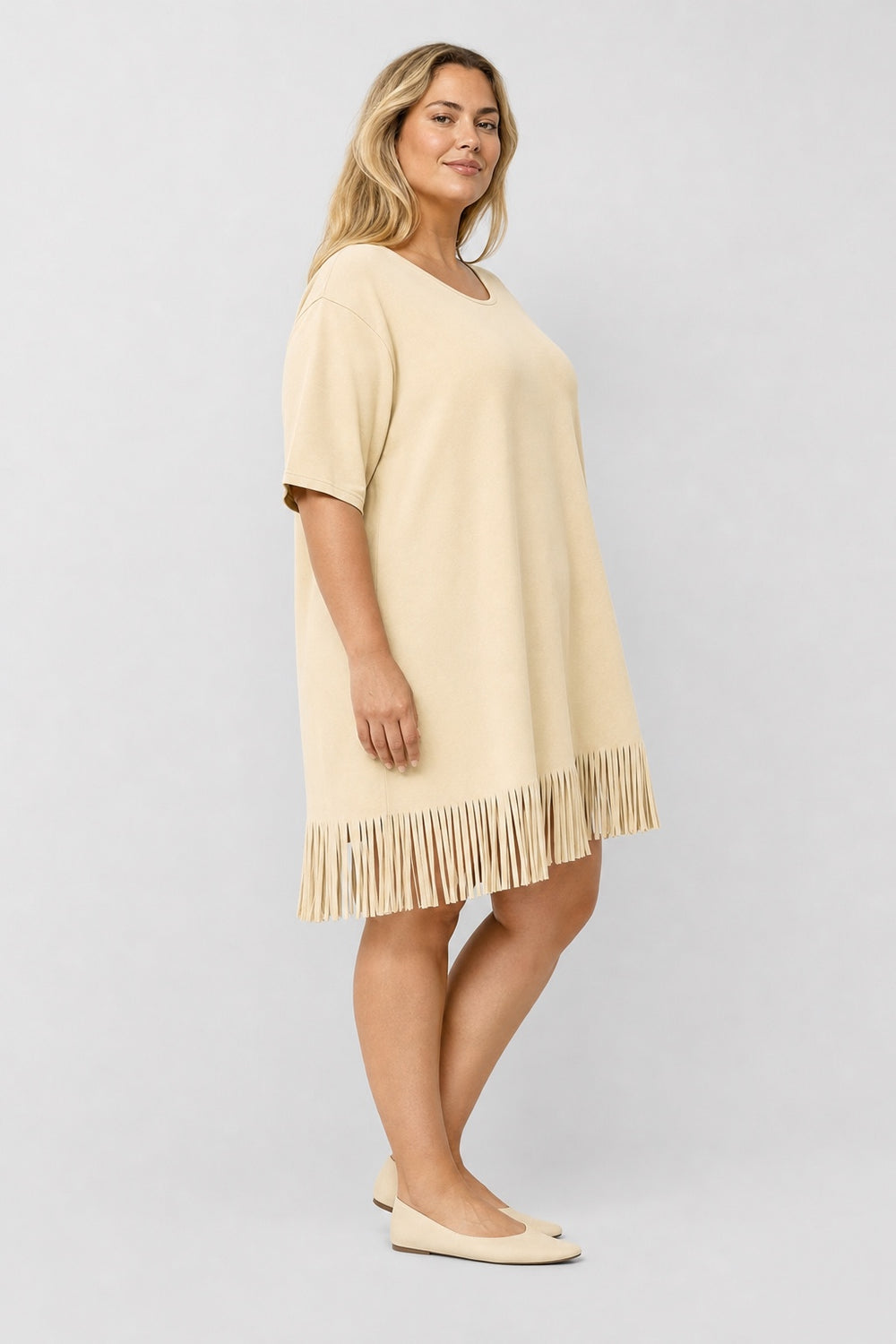 Brianna Boho Fringe Dress in beige – side view on a plus-size model