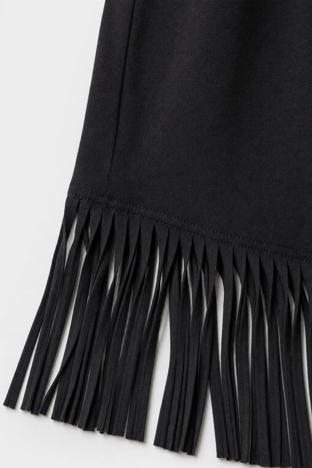 Brianna Boho Fringe Dress in black – close-up of the fringe hem and soft fabric