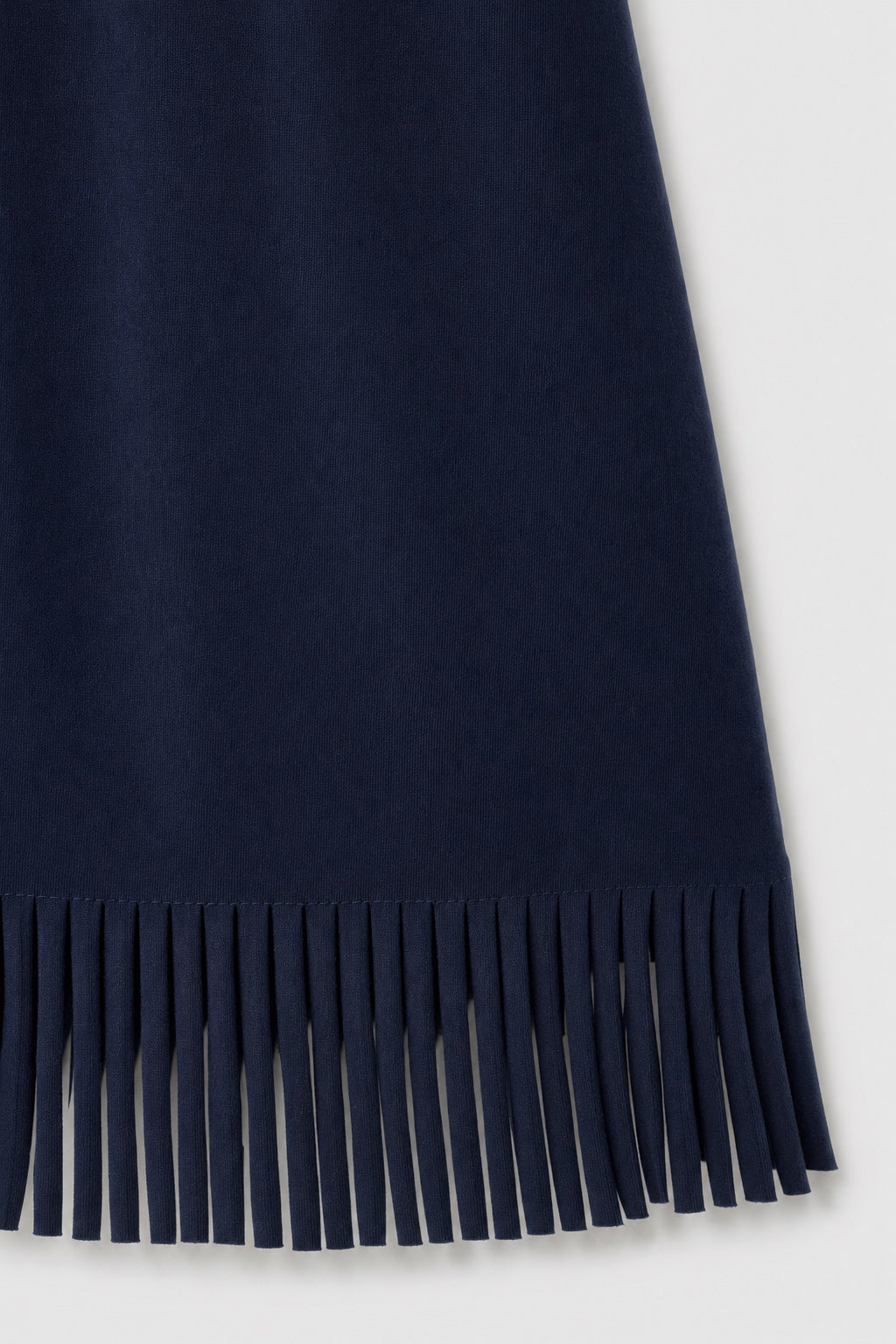 Brianna Boho Fringe Dress in navy blue – close-up of the fringe hem and soft fabric