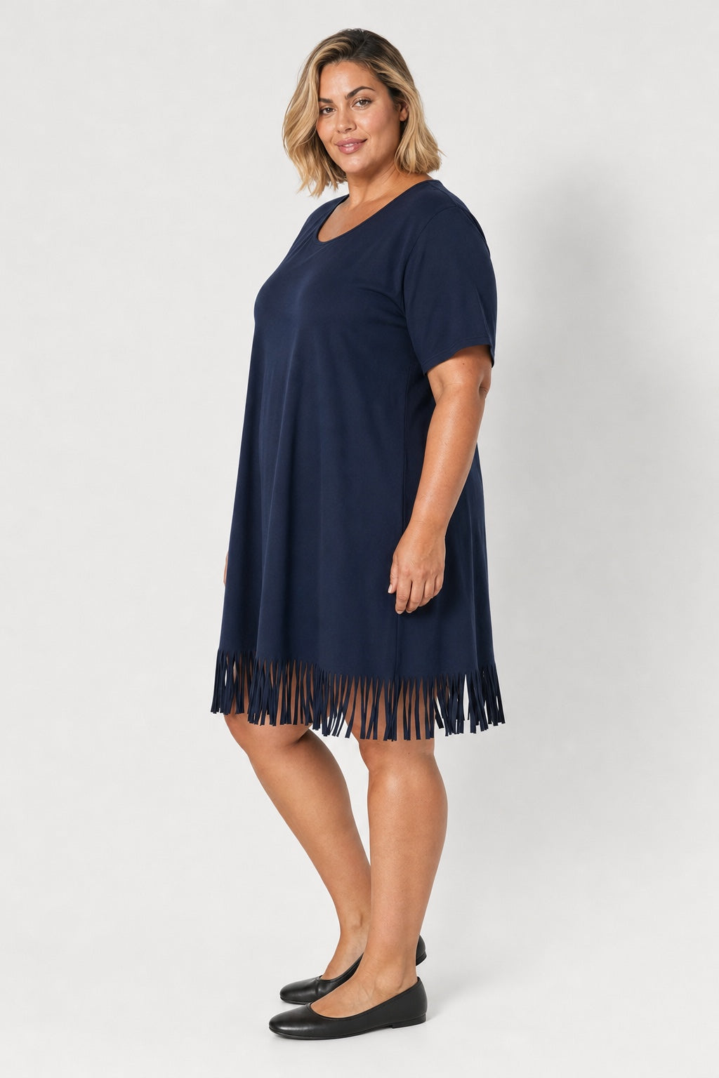 Brianna Boho Fringe Dress in navy blue – side view on a plus-size model