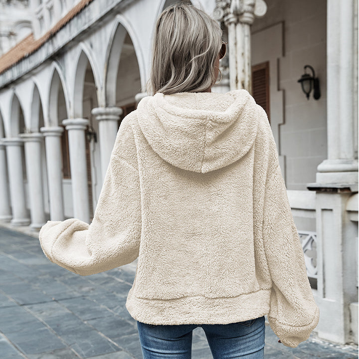 Woman wearing apricot plush hooded sweater with drawstring hood
