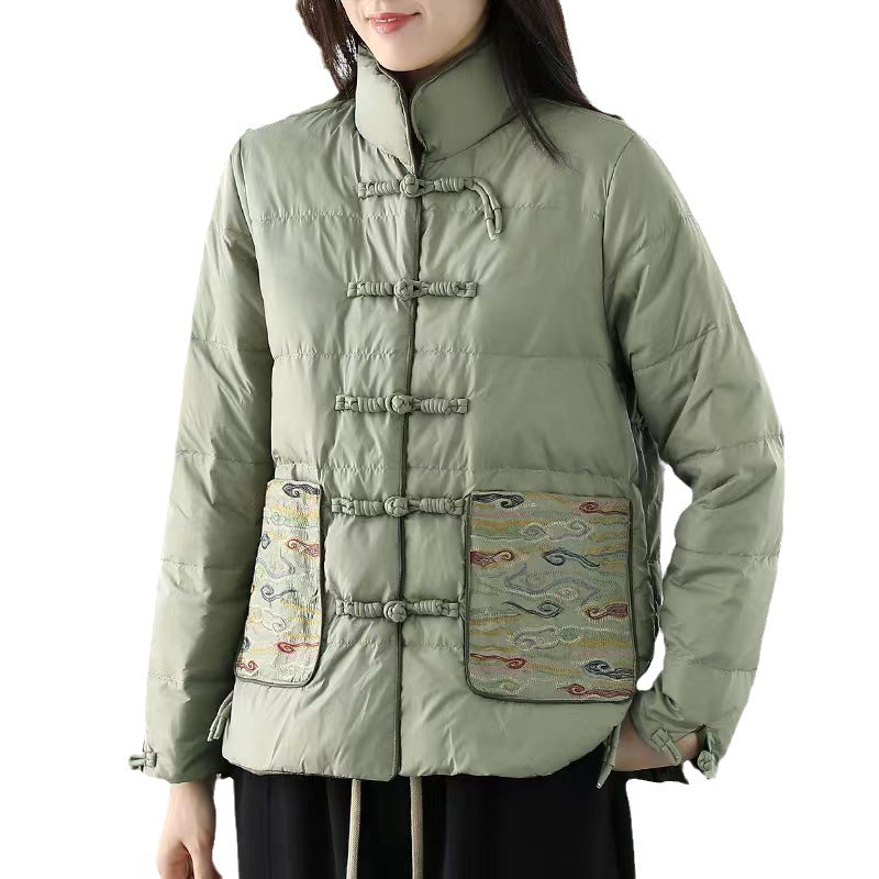 Woman wearing short embroidered down jacket with long sleeves