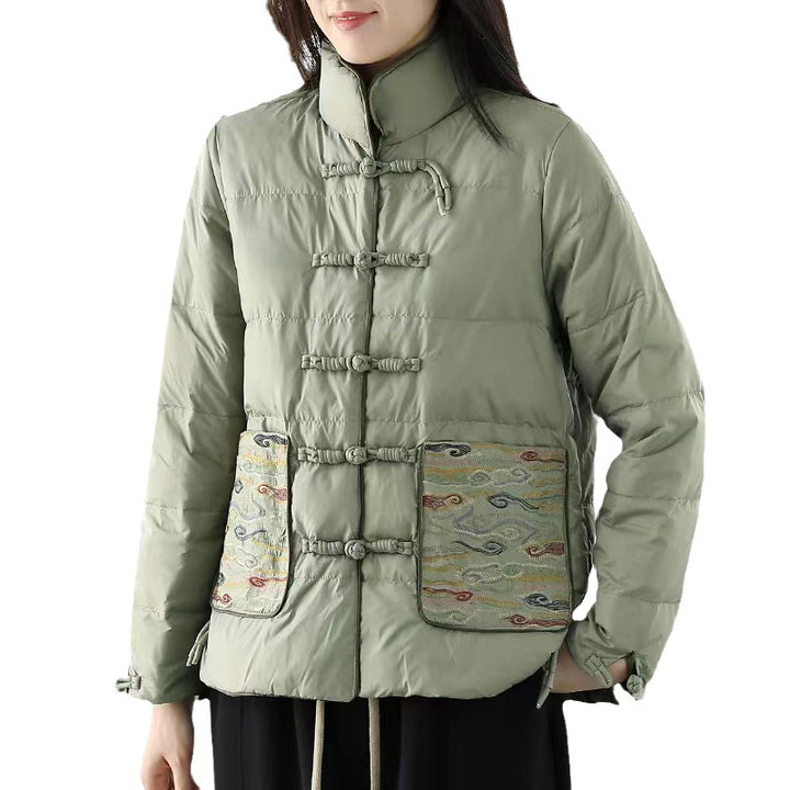Woman wearing short embroidered down jacket with long sleeves
