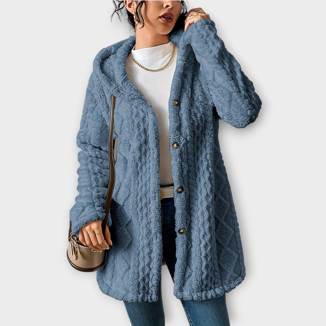 Woman wearing textured hooded winter jacket in relaxed fit