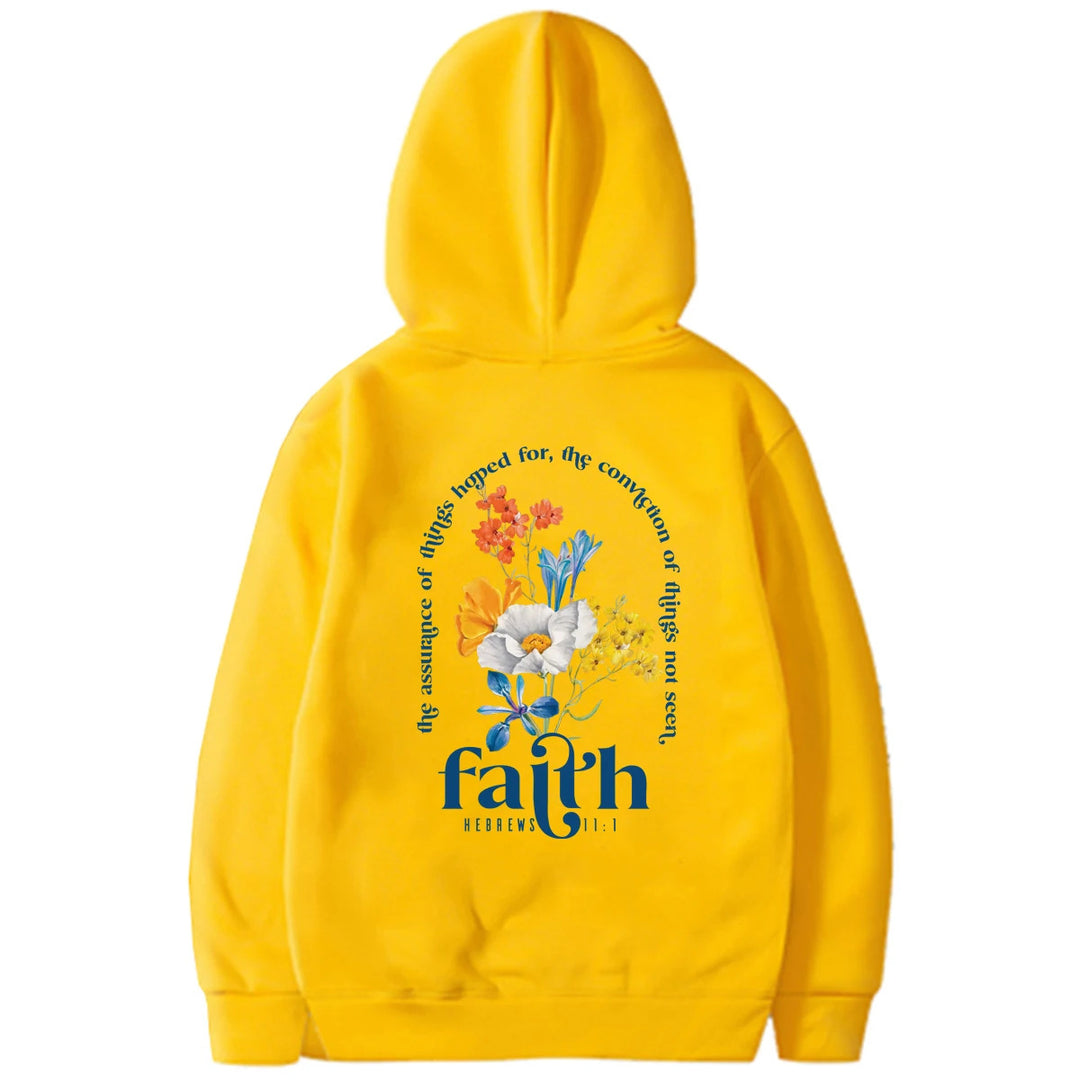 Woman wearing Bible verse graphic hoodie with long sleeves
