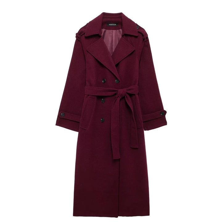 Woman wearing wine red long double-breasted trench coat with belt