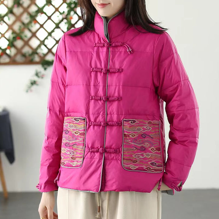 Woman wearing short embroidered down jacket with long sleeves