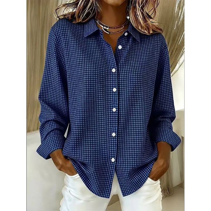 Woman wearing gingham button-front blouse with long sleeves