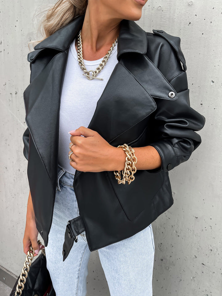 Woman wearing loose black PU leather lapel jacket