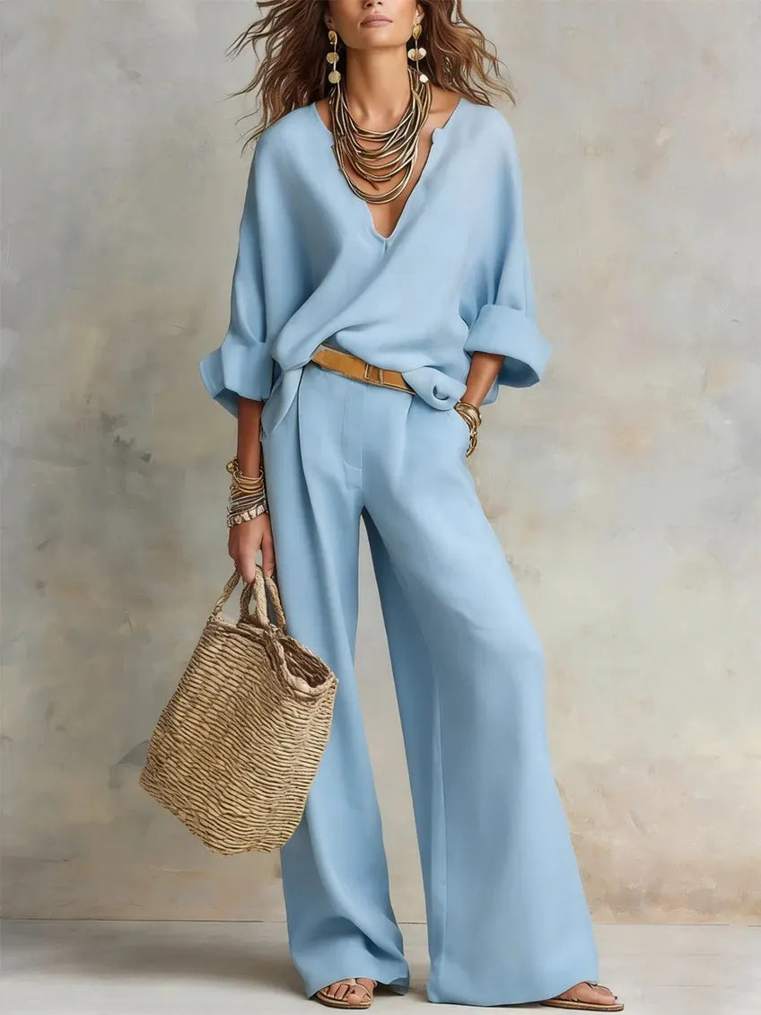 Woman wearing relaxed V-neck two piece set with wide-leg trousers