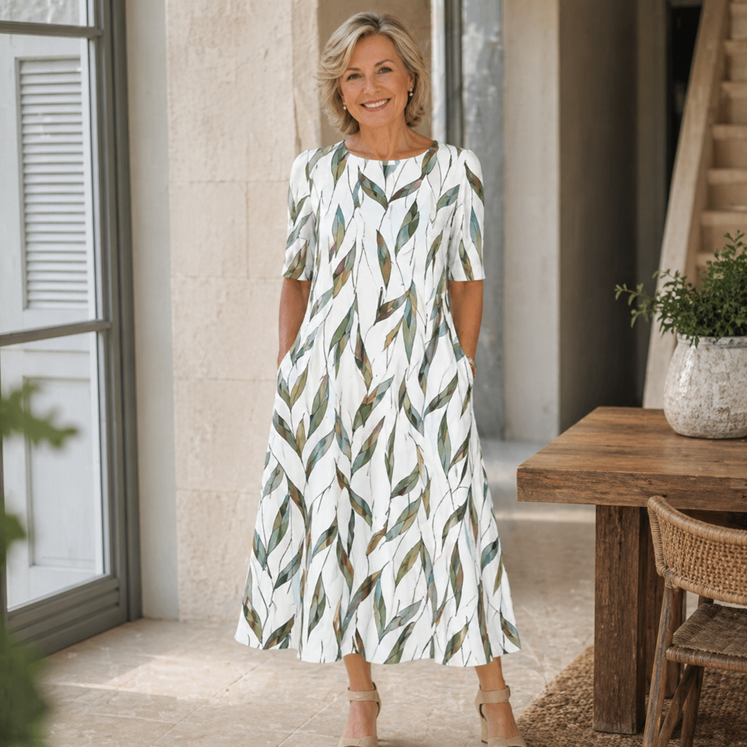 Woman wearing printed midi dress with side pockets outdoors