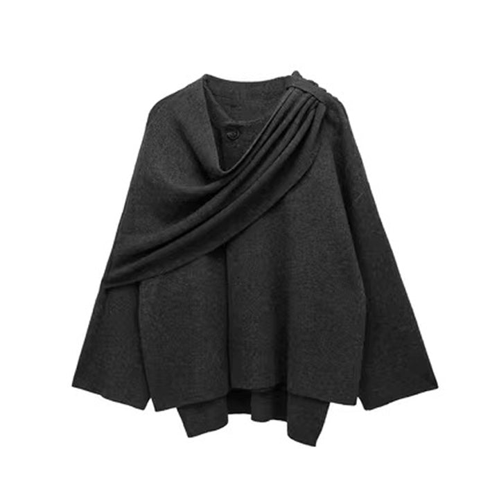 Woman wearing knit cardigan coat with asymmetric scarf detail