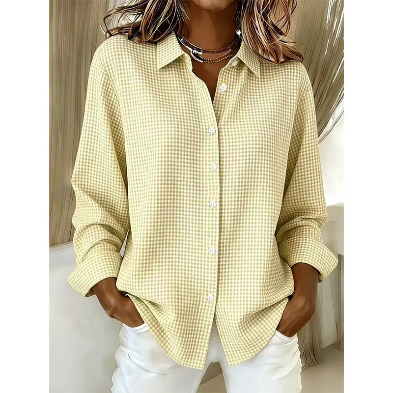 Woman wearing gingham button-front blouse with long sleeves