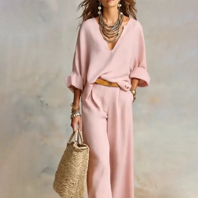 Woman wearing relaxed V-neck two piece set with wide-leg trousers