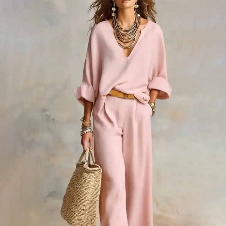 Woman wearing relaxed V-neck two piece set with wide-leg trousers