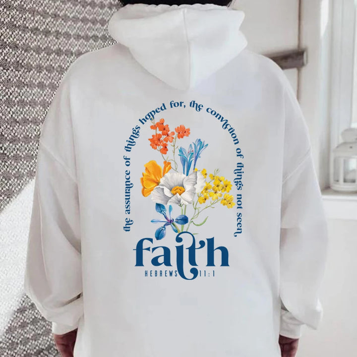 Woman wearing Bible verse graphic hoodie with long sleeves