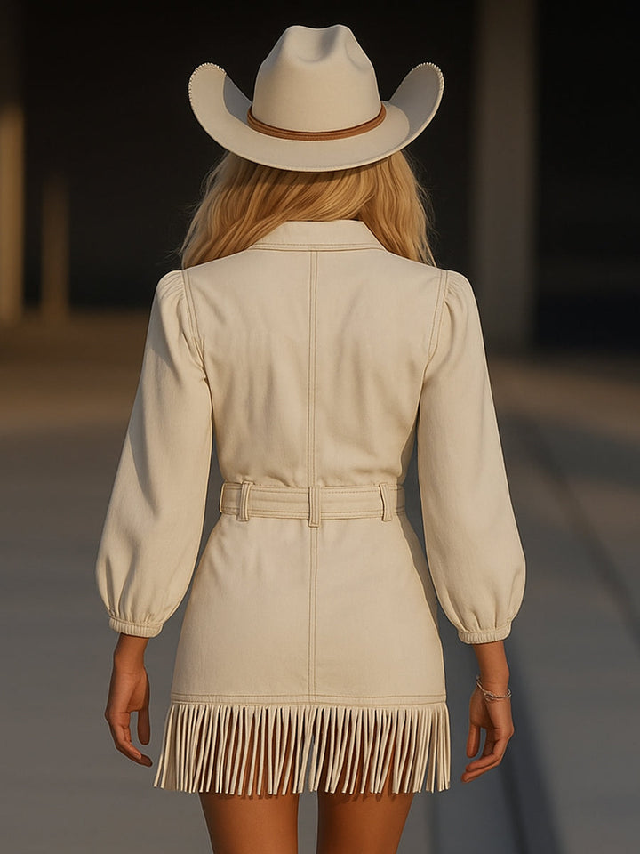 Woman wearing white mini dress with tassel details