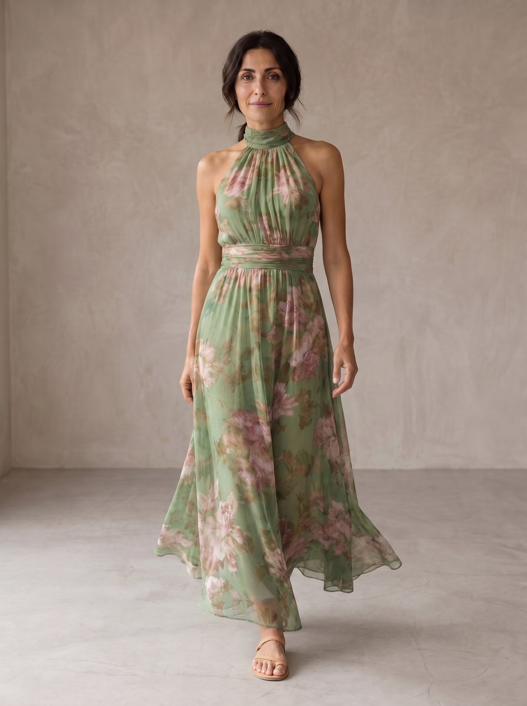 Woman wearing floral halter maxi dress with cinched waist