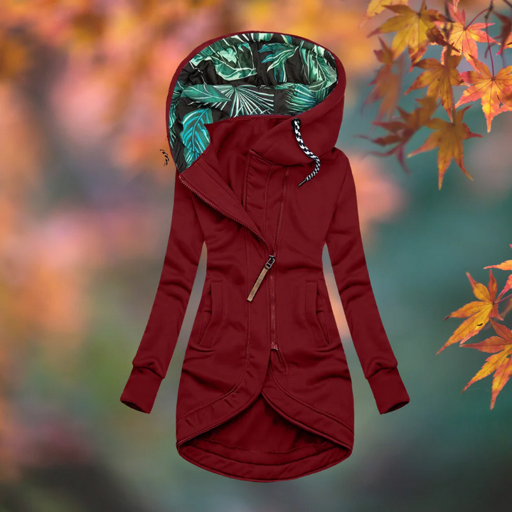 Woman wearing hooded rain coat with slim fit