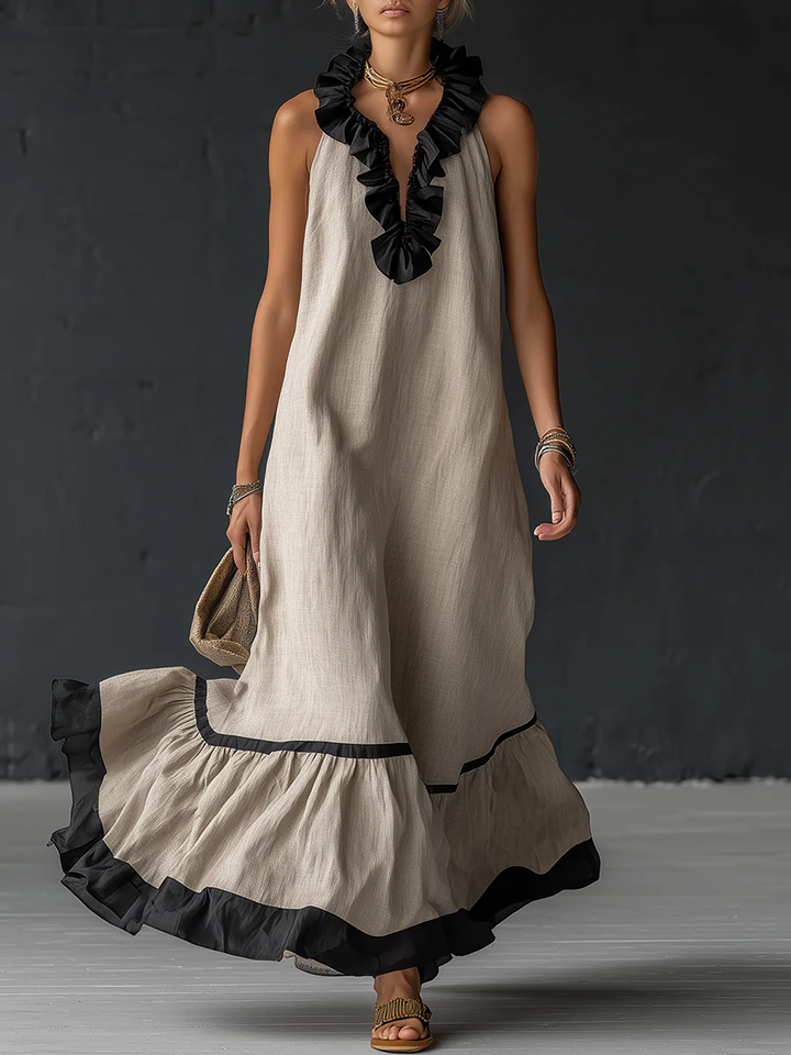 Woman wearing sleeveless color block maxi dress with ruffles