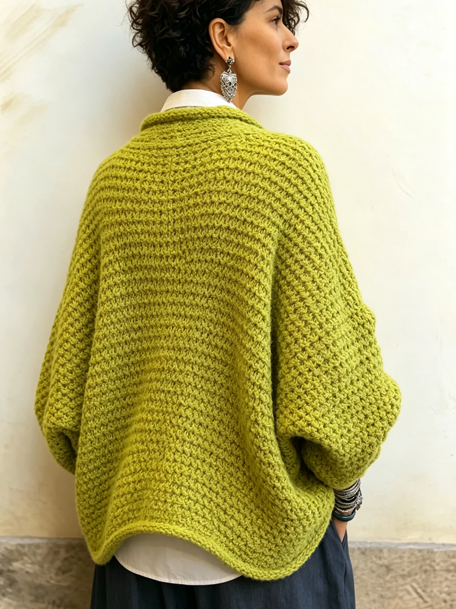 Woman wearing crossover V-neck batwing sleeve sweater